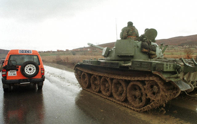 T-55_next_to_an_OSCE_vehicle_in_Kosovo.jpg